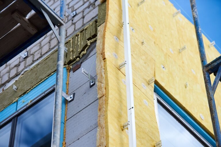 office building under construction. Facing and insulation of walls