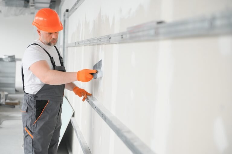 worker-plastering-interior-gypsum-board-wall