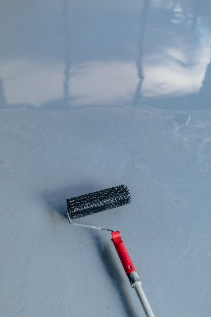 Applying resin coating to smooth concrete floor