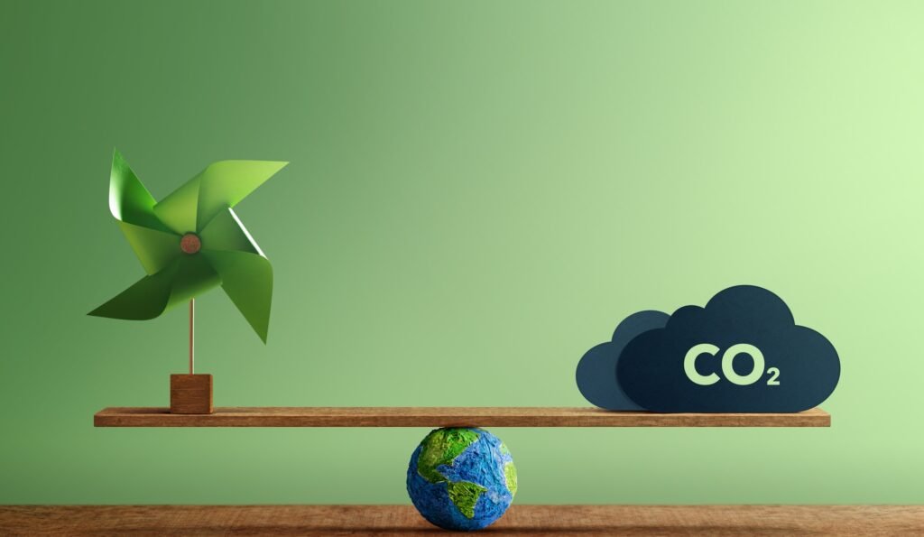 Carbon Neutral and ESG.Carbon Emission,Clean Energy. Globe Balancing a Wind Turbine and CO2