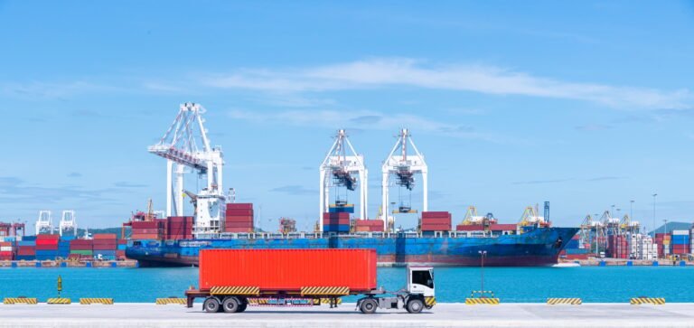 Cargo-ship-and-truck-at-seaport-waiting-for-container