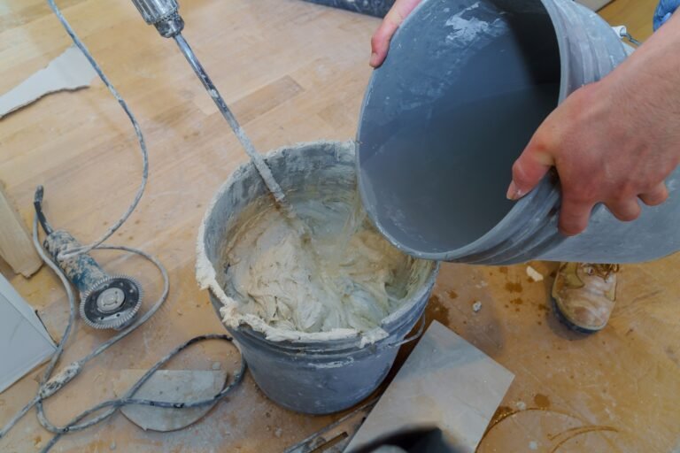 Cement mix using an electric drill in a bucket