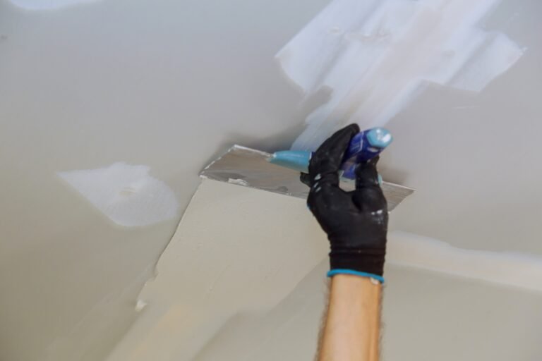 man-filling-gypsum-wall-joints