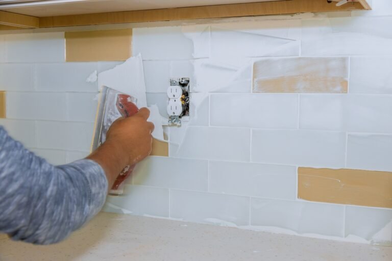 grouting-tile-with-tool-on-tile-wall