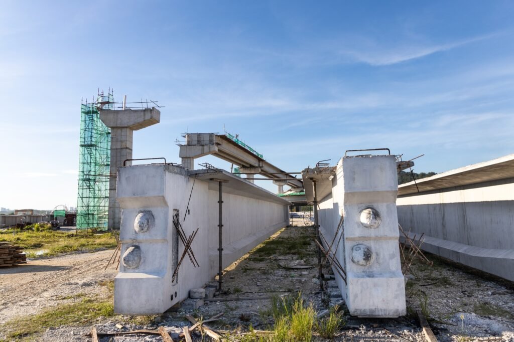 Pre-fabricated concreate beams with mass rail transit line construction in background