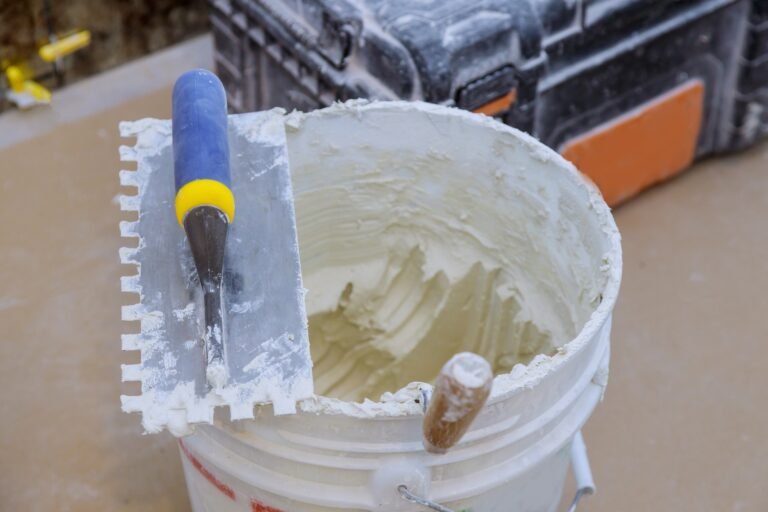 grout mortar in a new cement trowel