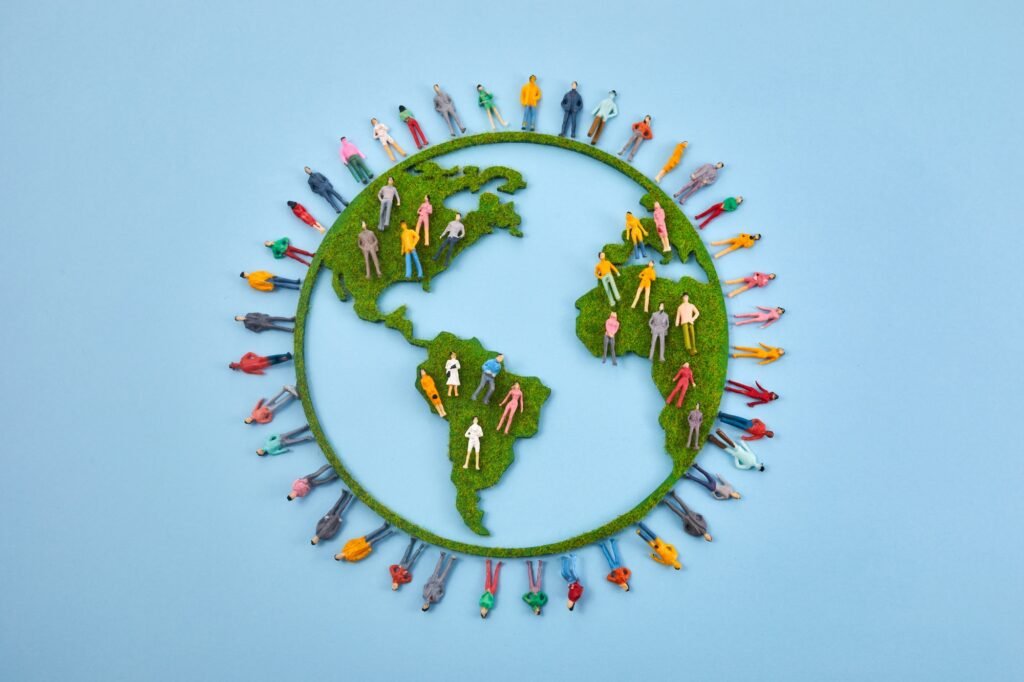 World Population Day, creative concept. Large and diverse group of people in the shape of the world